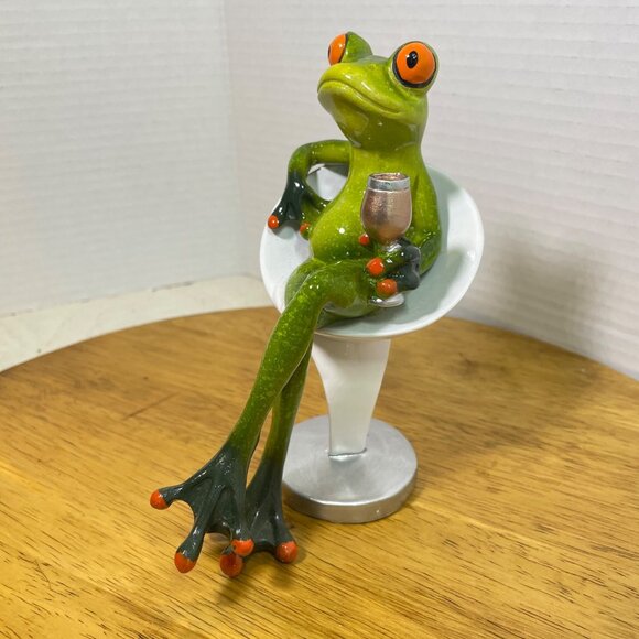Green Ceramic Frog Figurine With Wine Glass Sitting In Modern White Chair - Picture 2 of 10